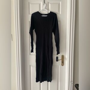 Woman’s long sleeved fitted dress